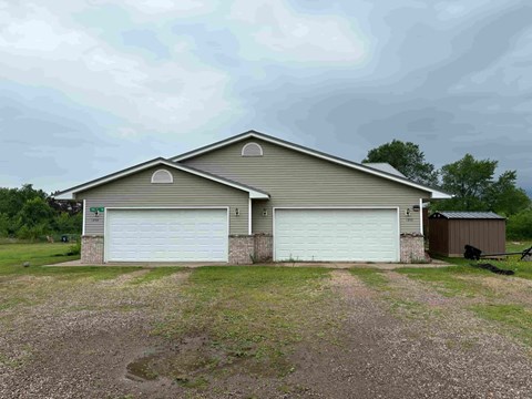 A two-car garage is attached to a house.