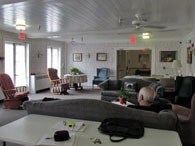 A living room with a couch and a table.