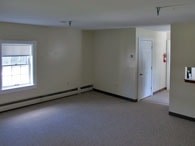 A room with a window and a door.