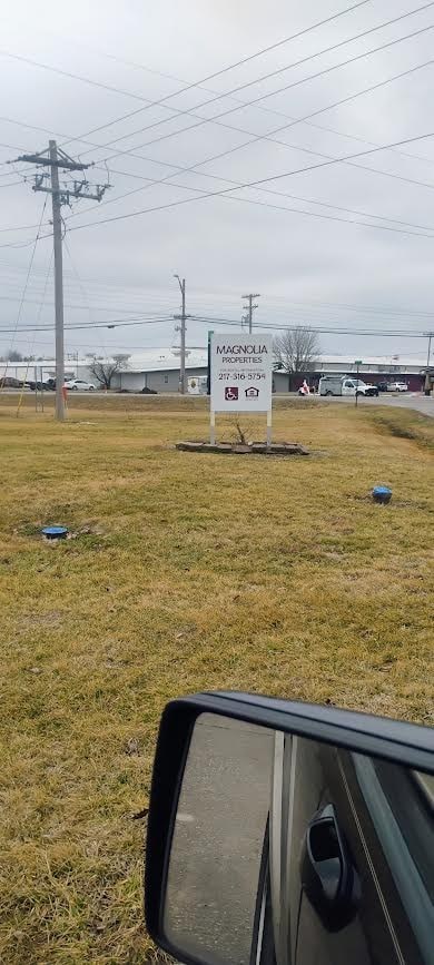 A sign in front of a building that says Magnolia.