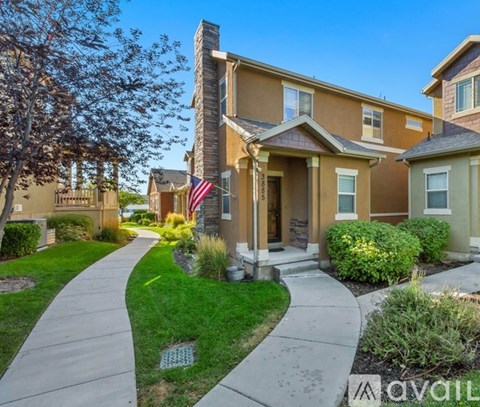 A house with a flag on the front porch is for sale.