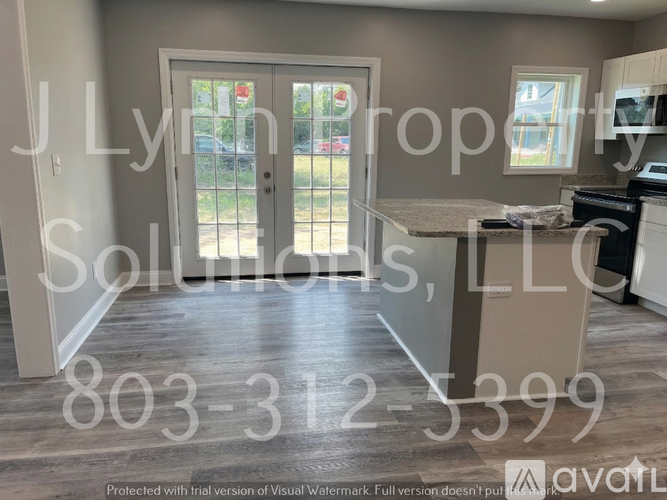A kitchen with a counter and a sink is shown in a property listing.
