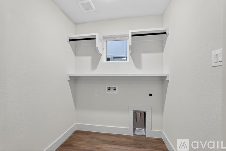 A modern kitchen with dark cabinets and a center island.