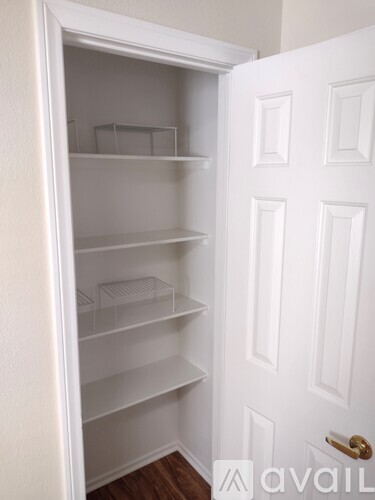 A white door with a gold handle and a white interior.