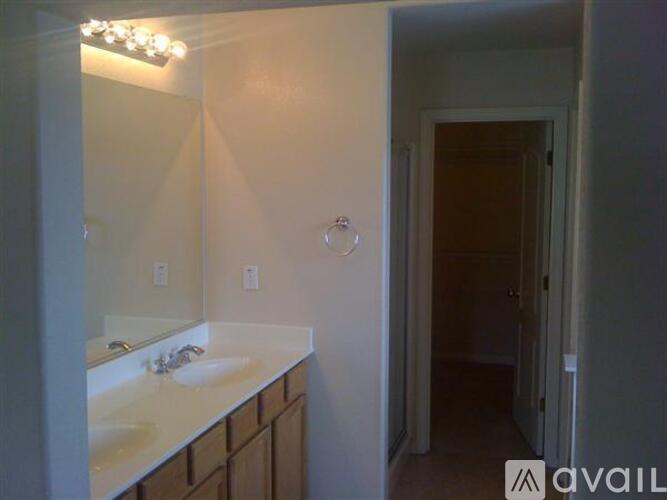 A bathroom with a sink and mirror.