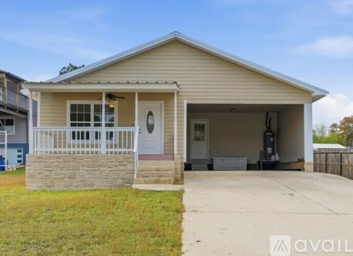 A two-story house with a garage is available for rent.
