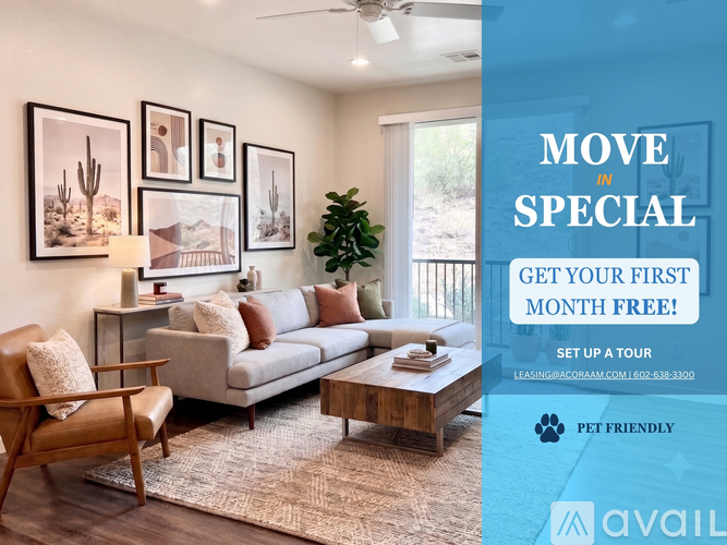 A living room with a couch, chair, and pictures on the wall.