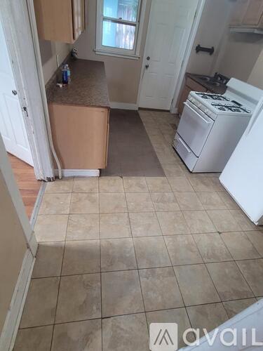 A kitchen with a washer and dryer in it.