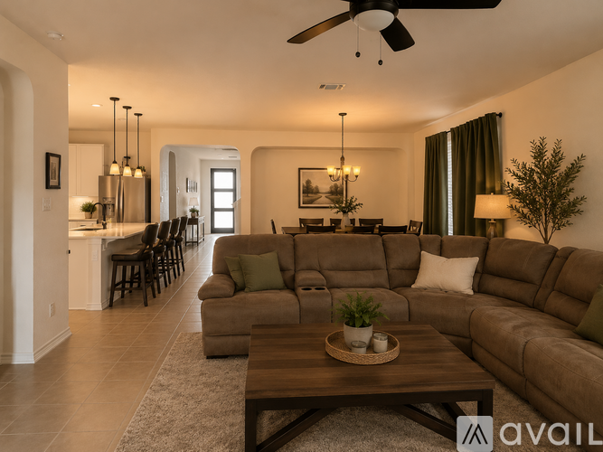 A modern living room with a large sectional sofa and a wooden coffee table.