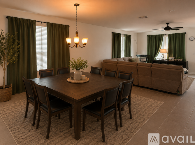 A dining room with a wooden table and chairs.