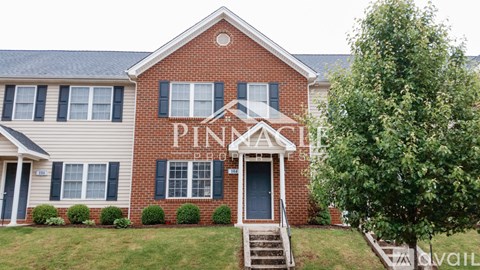 A brick house with the word PINKA on it.