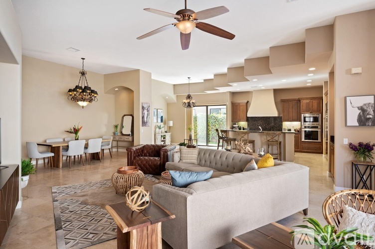 A modern living room with a grey sofa and a wooden coffee table.