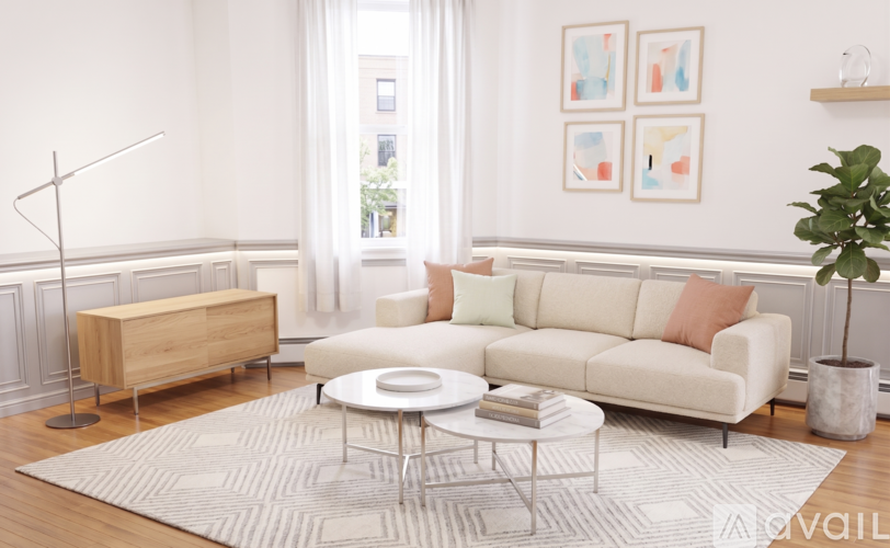 A living room with a white sofa, a wooden cabinet, a glass coffee table, and a potted plant.