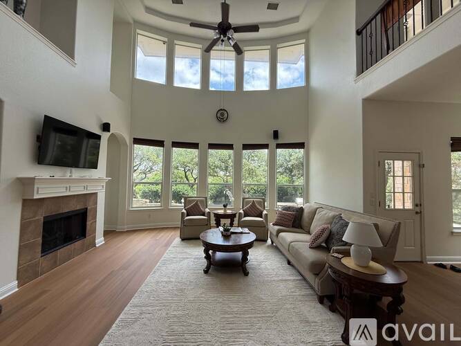 A living room with a fireplace and a couch.