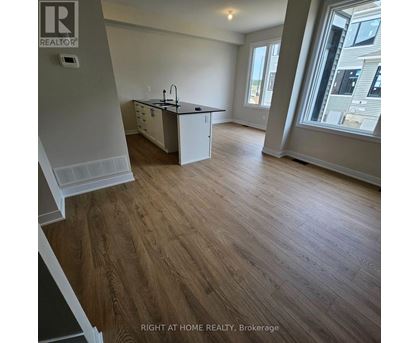 A kitchen with a sink and a window.