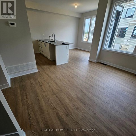 A kitchen with a sink and a window.
