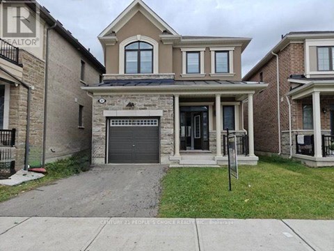 A house with a garage is for sale.