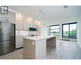 A modern kitchen with wooden cabinets and a central island.