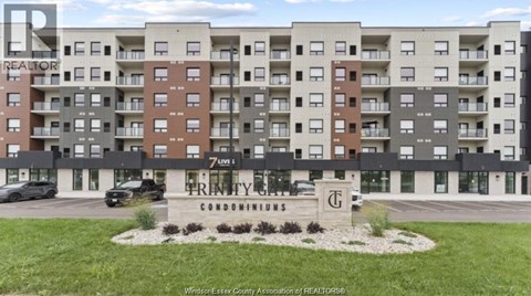 A large apartment complex with a sign that says Prentice Condominiums.