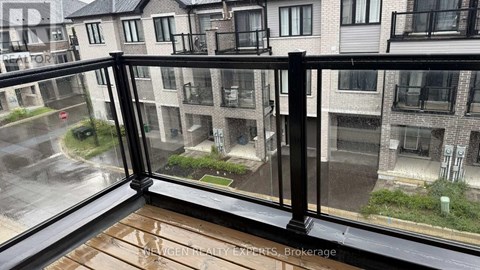 A rainy day in a residential area with apartment buildings.