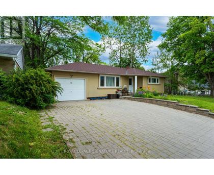A house with a driveway in front of it.
