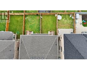 A bird's eye view of a rooftop of a building with a sign that says REALTY ONE GROUP DELTA Brokerage.