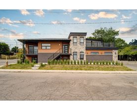 A two-story house with a brown and orange exterior.