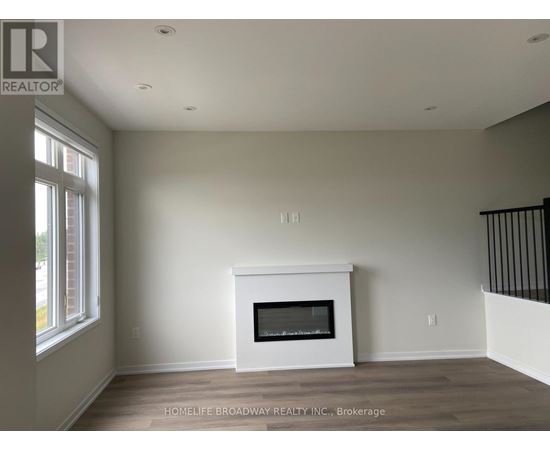 A room with a fireplace and a window.