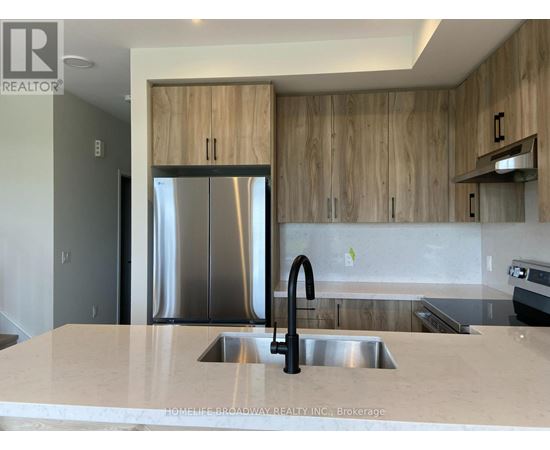 A modern kitchen with a sink and wooden cabinets.