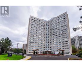 A large, modern building with a sign that reads "Royal LePage Signature Realty Brokerage.".