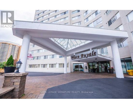 A large white canopy structure is in front of a building with a sign that reads "Place Royale".