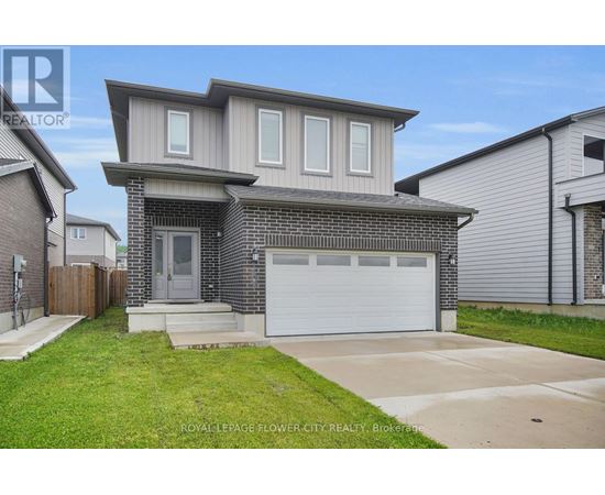 A two-story house with a garage is for sale.
