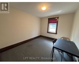 A room with a table and a chair in it.