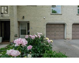 A building with the number 85 on the door and a sign that says REALTOR.