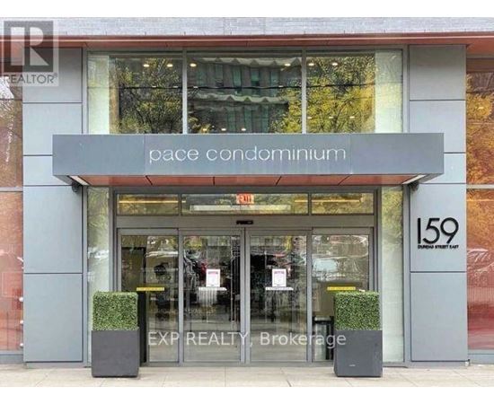 The front of a building with the words "pace condominium" written on it.