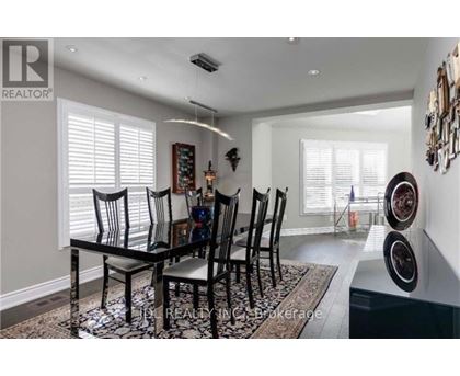 A dining room with a table set for six.