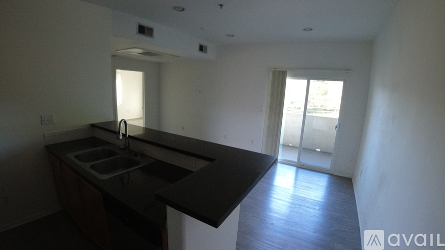 A kitchen with a sink and a window.