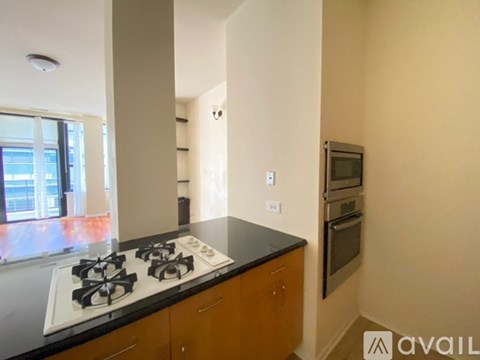 A kitchen with a stove top oven and a microwave.