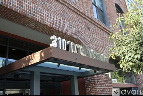 A building with a sign that says "3107" on it.