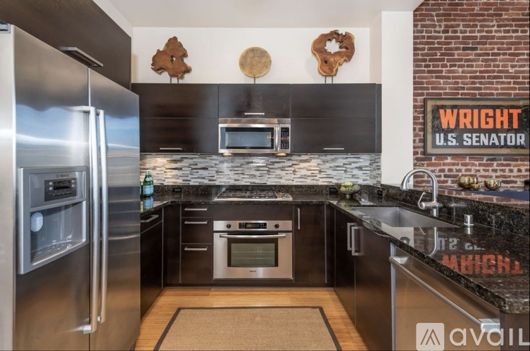 A kitchen with a refrigerator on the left and a sign that says "WRIGHT U.S. SENATOR" on the right.