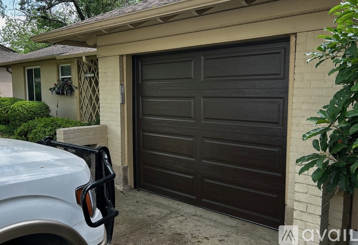 A black garage door is closed.