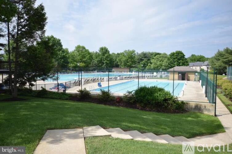 A bright sunny day at the outdoor swimming pool.