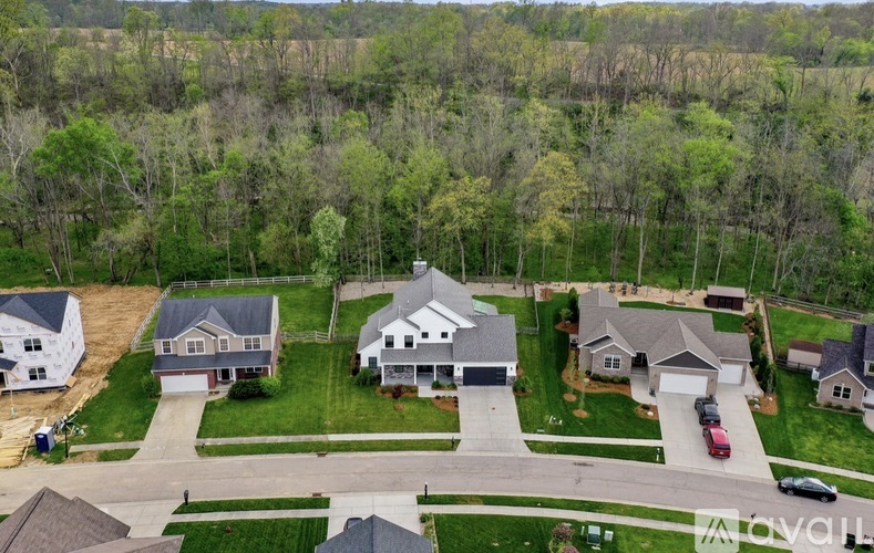 A suburban neighborhood with houses and trees.