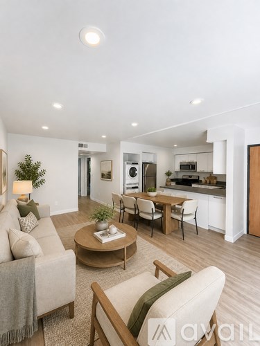 A living room with a couch, chair, and coffee table.