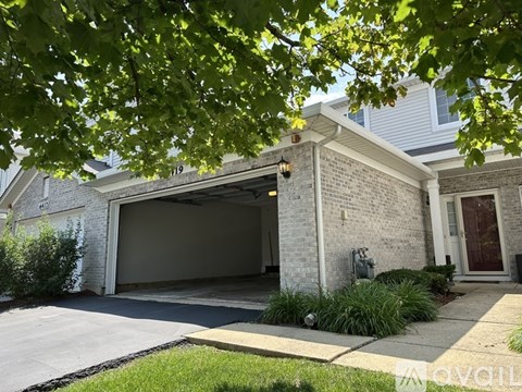 A house with a garage and a driveway.