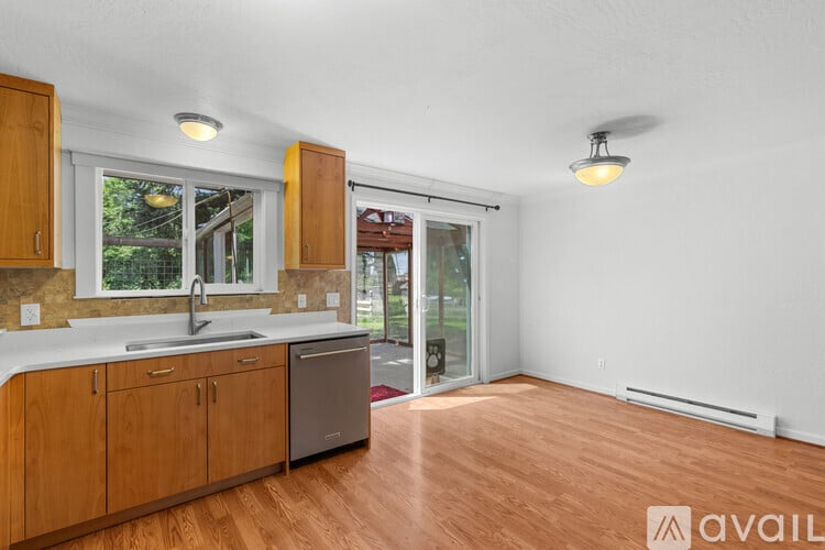 A kitchen with wooden cabinets and a white countertop.