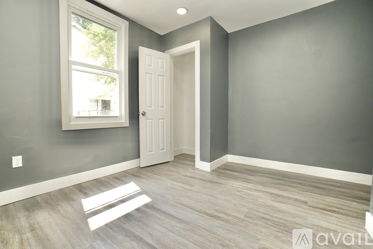A room with a door and a window.