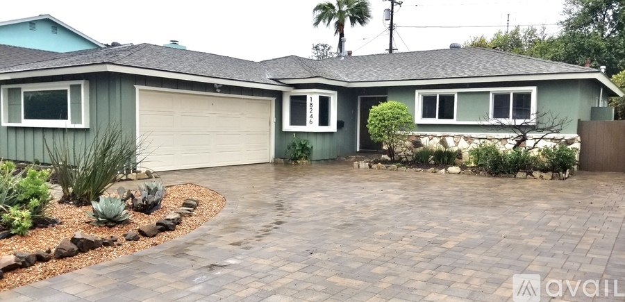 A house with a driveway and a garage door.