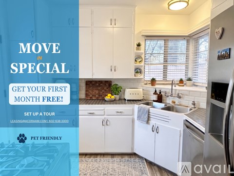 A kitchen with white cabinets and a blue banner offering a free first month for a tour.
