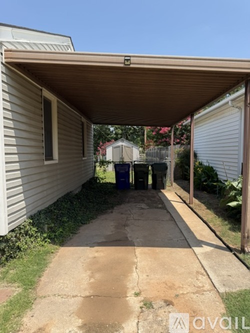 A covered walkway leads to a garage.